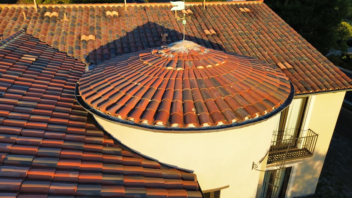 Close-up of new clay tile on a round turret roof