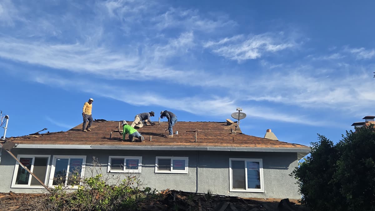 RD Fast crew working on a shingle roof tear-off