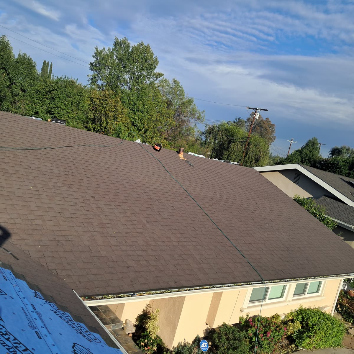 New shingle roof installed over fresh underlayment