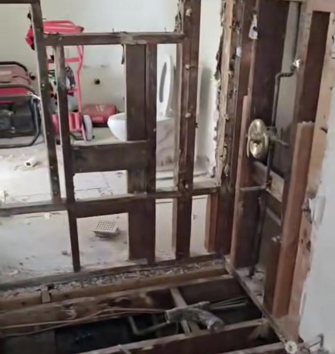 During the remodel: bathroom opened to the framing with new plumbing valves going in