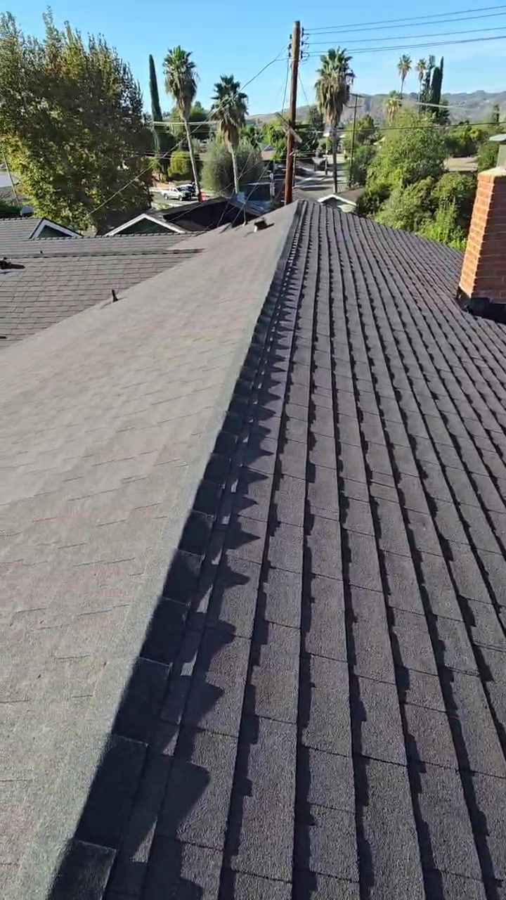 Finished asphalt shingle roof in Woodland Hills with a straight new ridge line