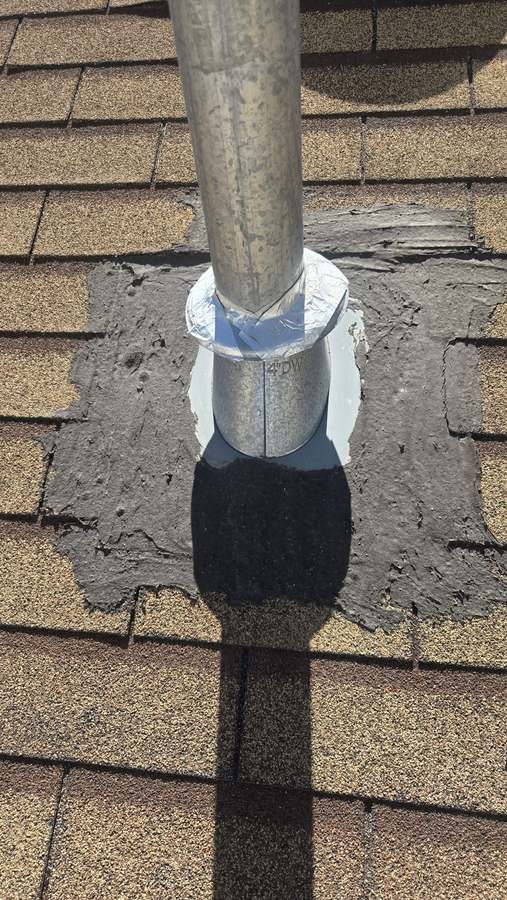 Roof inspection: old mastic patch around a vent pipe boot